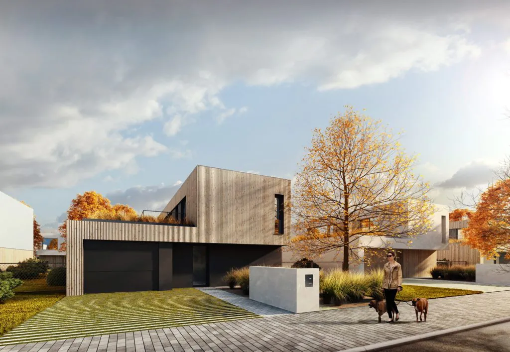 street view of a family house in New Zelenec with wooden facade and a woman walking dogs on a sidewalk